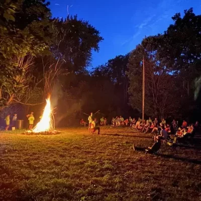 Scouts share skits around a campfire at Small Island